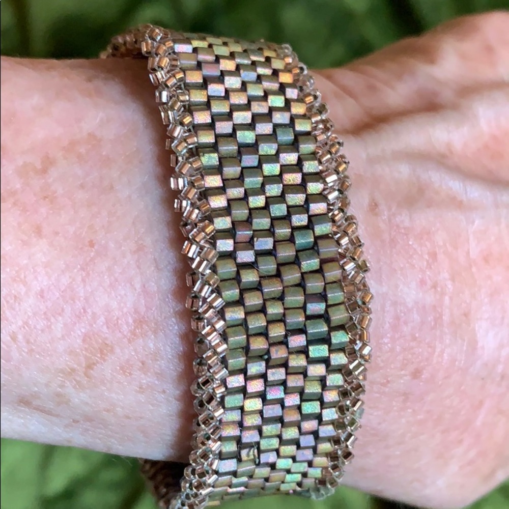 Hand-beaded bracelet with slide closure.